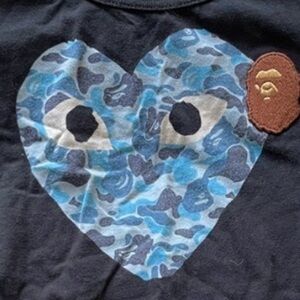 Comme des Garcons PLAY Black Tee with Blue Heart Graphic